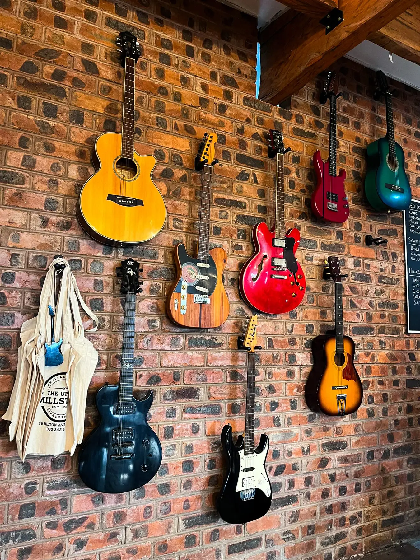 The wall of guitars on facebrick at The Upper Millstone