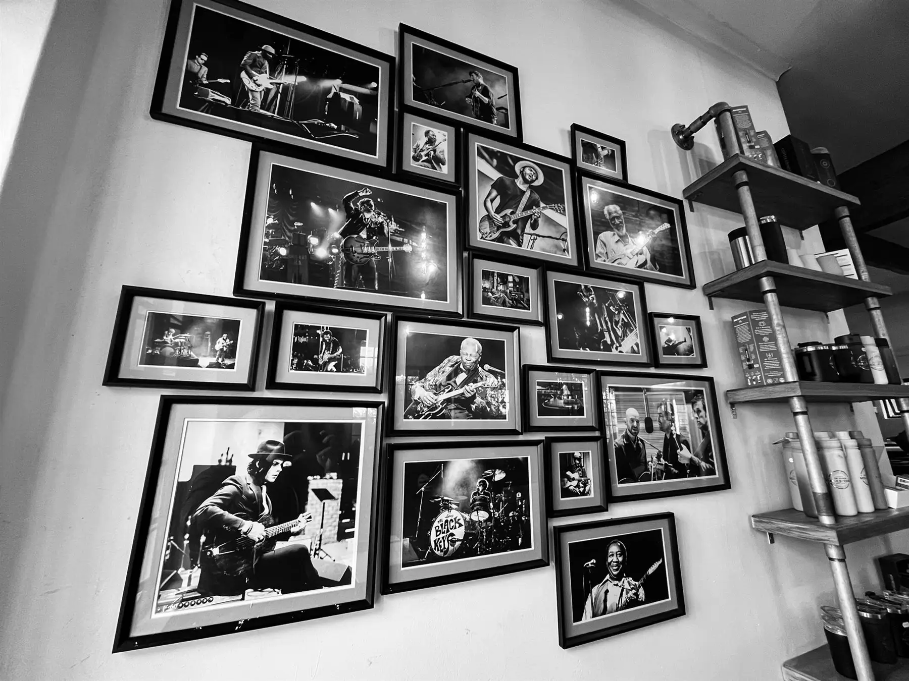 Black and white wall of framed music photographs
